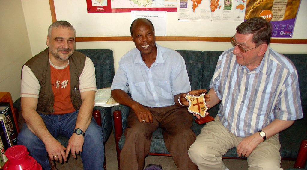 These society members visited Bishop Z. Kahuthu (center), the head of the Kenya Evangelical Lutheran Church (KELC).