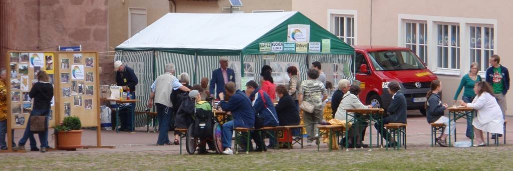 View of the society's café-and-information tent with billboard on work in Africa visible on the left.